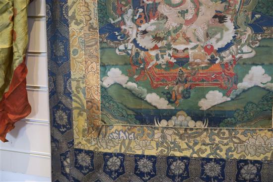 A thangka depicting Padmasambhava in the form of Nyima Ozer, Tibet, 19th century Total dimensions 133cm x 86cm